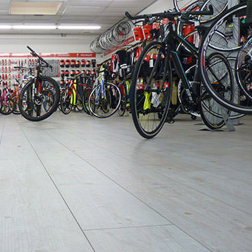 Bicycle Specialist Chooses Floor Covering Specialist